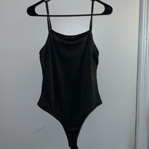 Pretty little thing bodysuit. It is dark grey and a US size 6 so a medium!